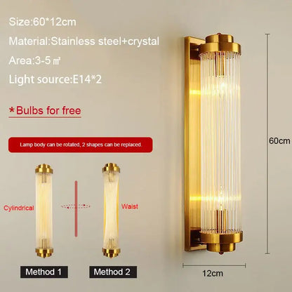 Modern black and gold crystal wall lamp featuring a gold-finished cylindrical crystal body and stainless steel frame
