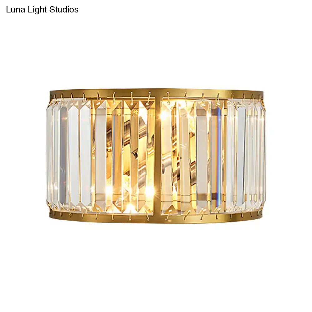 Gold-finished modern wall sconce with vertical crystal prisms 16 inch fixture height suitable for e12 and e14 bulbs
