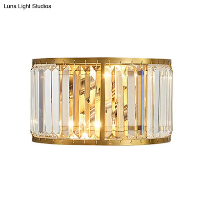 Gold-finished modern wall sconce with vertical crystal prisms 16 inch fixture height suitable for e12 and e14 bulbs