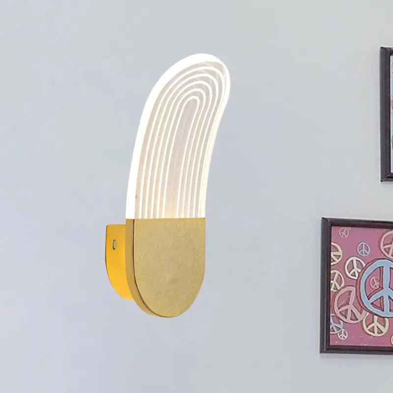 Modern black and gold curved led sconce light with concentric white light strips on a metallic wall lamp base