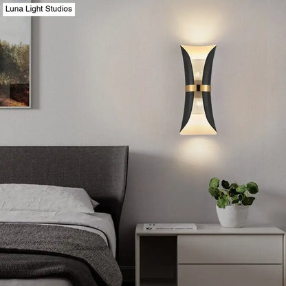 Modern black and gold curved wall lamp with sleek design perfect for bedroom lighting and decor