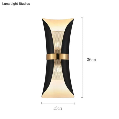 Modern black and gold curved wall lamp with sleek design and central mesh panel for bedroom lighting
