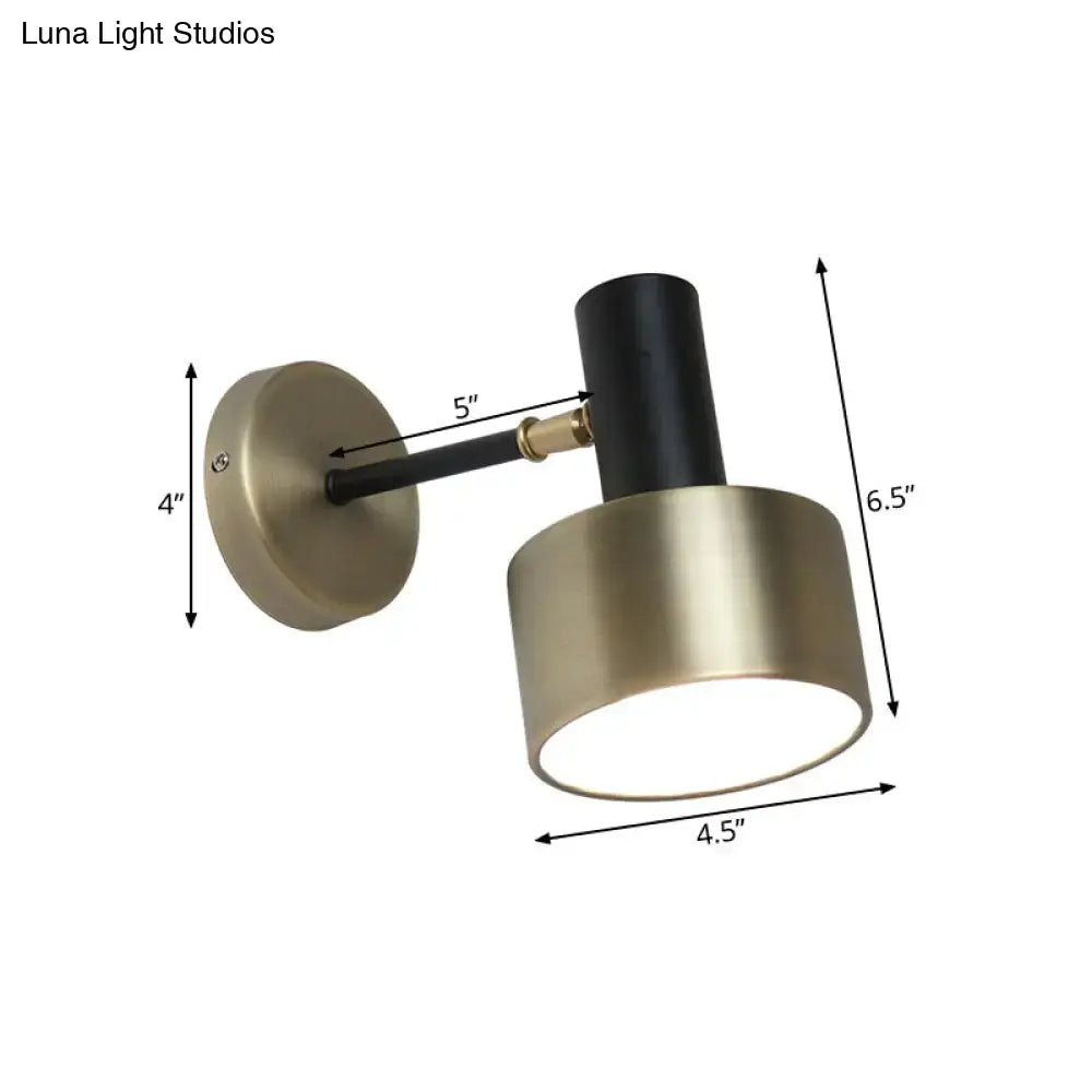 Modern black and gold cylinder sconce metal wall lighting with brushed brass base and adjustable arm for living room use