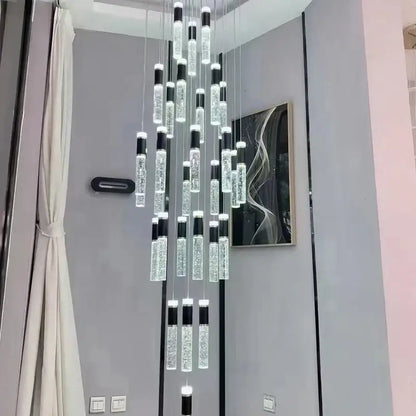 Modern black and gold decorbites cylindrical crystal chandelier with glowing golden liquid bubbles for living room light