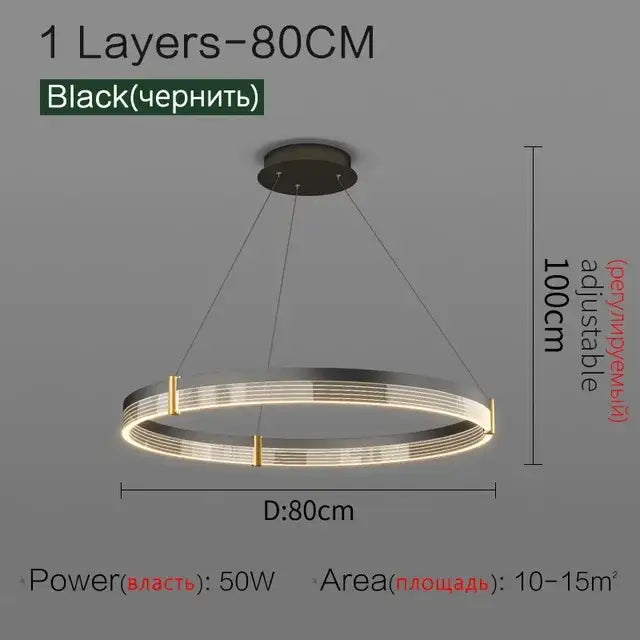 Modern black and gold decorbites circle chandelier with illuminated rings and gold accents for dining room lighting