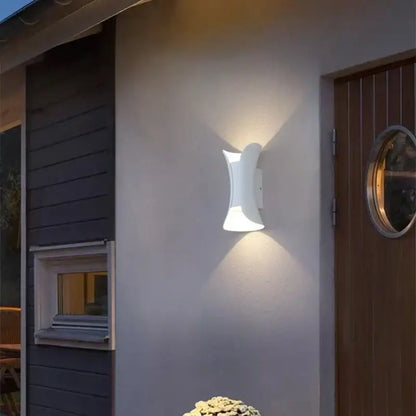 White ceramic wall lamp with sleek curved design from decorbites led waterproof collection for modern living room decor