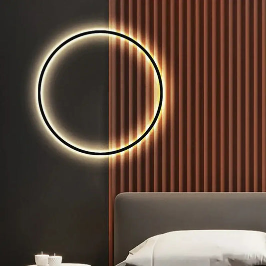 A sleek dimmable black gold wall lamp with warm led glow mounted on dark wood panel for modern living room decorbites lighting