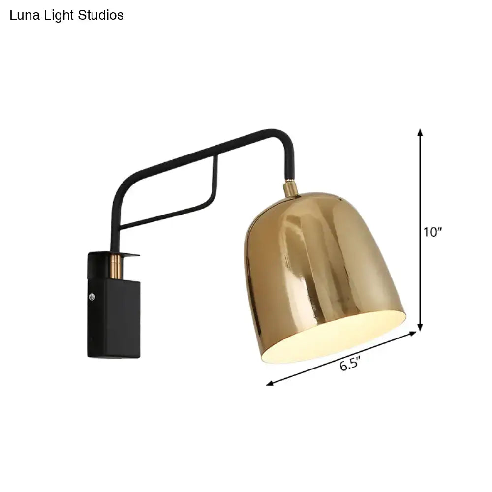 A sleek modern black and gold dome wall sconce with polished brass shade and curved arm for 220v-240v or 110v-120v use