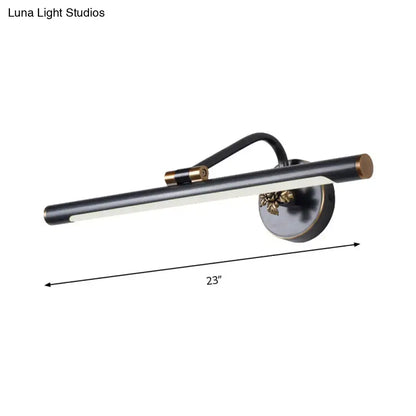 Modern black and brass vanity wall sconce with sleek cylindrical LED light bar for bedroom vanity wall lighting
