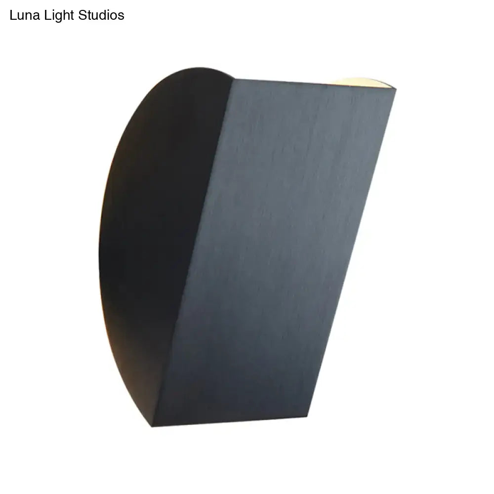 Modern black and gold folded wall light sconce with a sleek curved rectangular design for bedroom decor