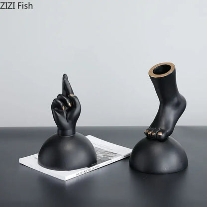 Modern black resin foot statue artwork with gold nail accents designed as elegant living room decor pieces