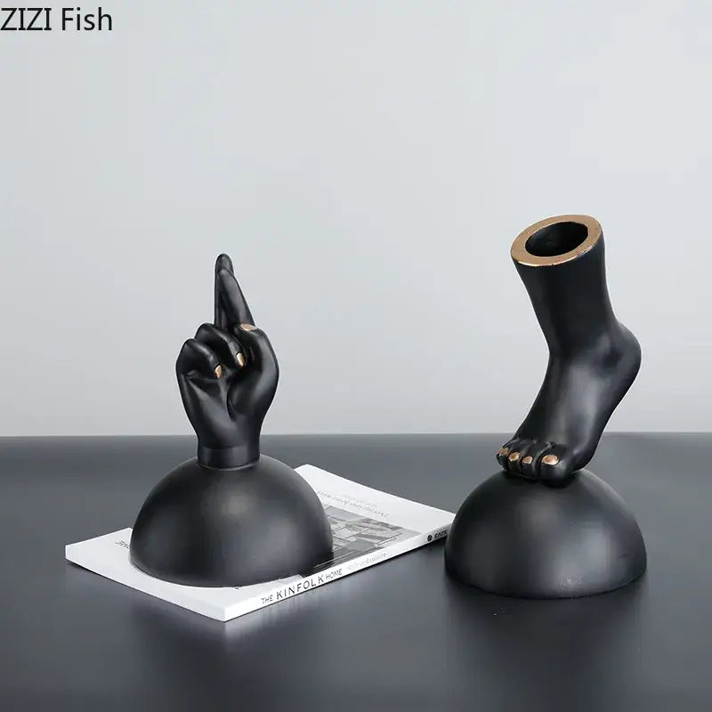 Modern black resin foot statue artwork with gold nail accents designed as elegant living room decor pieces