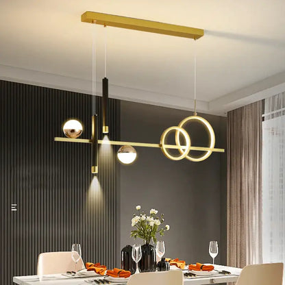 Modern gold-toned DecorBites LED pendant lights with geometric circular rings and spherical bulbs for kitchen and office
