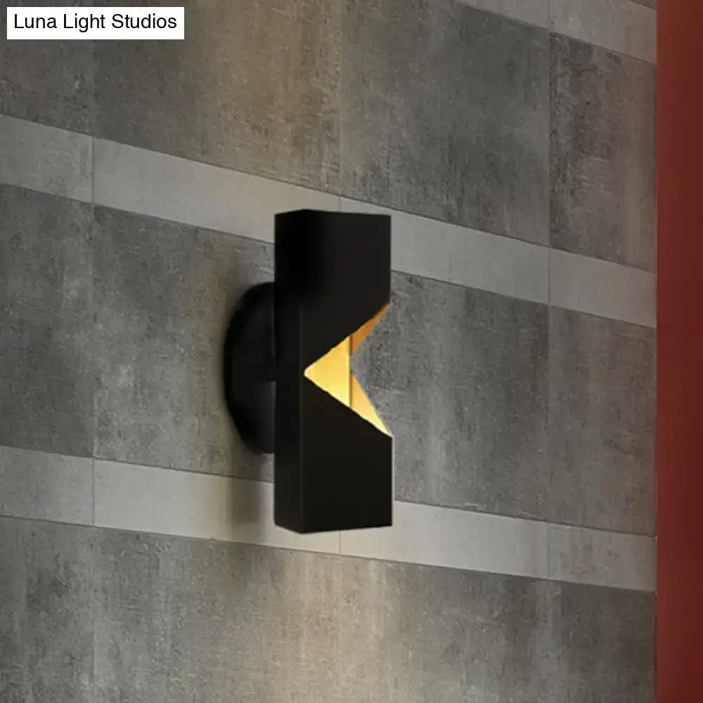 Modern black and gold geometric led wall sconce with iron shade and glowing gold triangular accent inch fixture