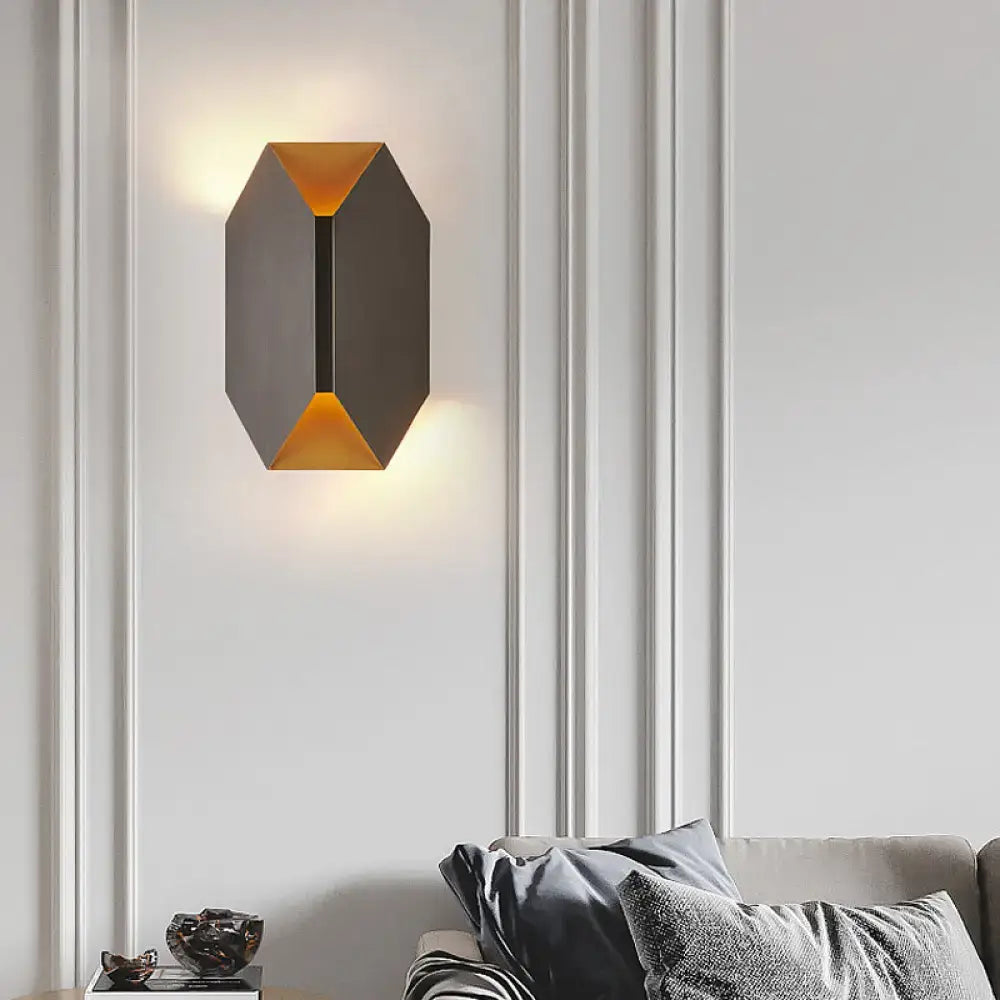 Modern black and gold geometric led wall lamp with matte black exterior and warm gold interior lighting for bedroom sconce