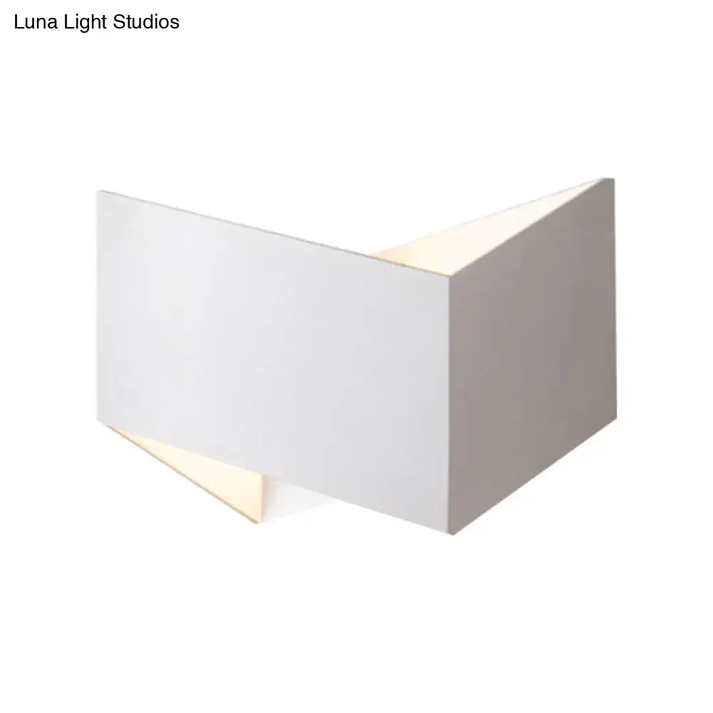 Minimalist white geometric metal body wall lamp with clean lines and a soft warm glow for stairway lighting
