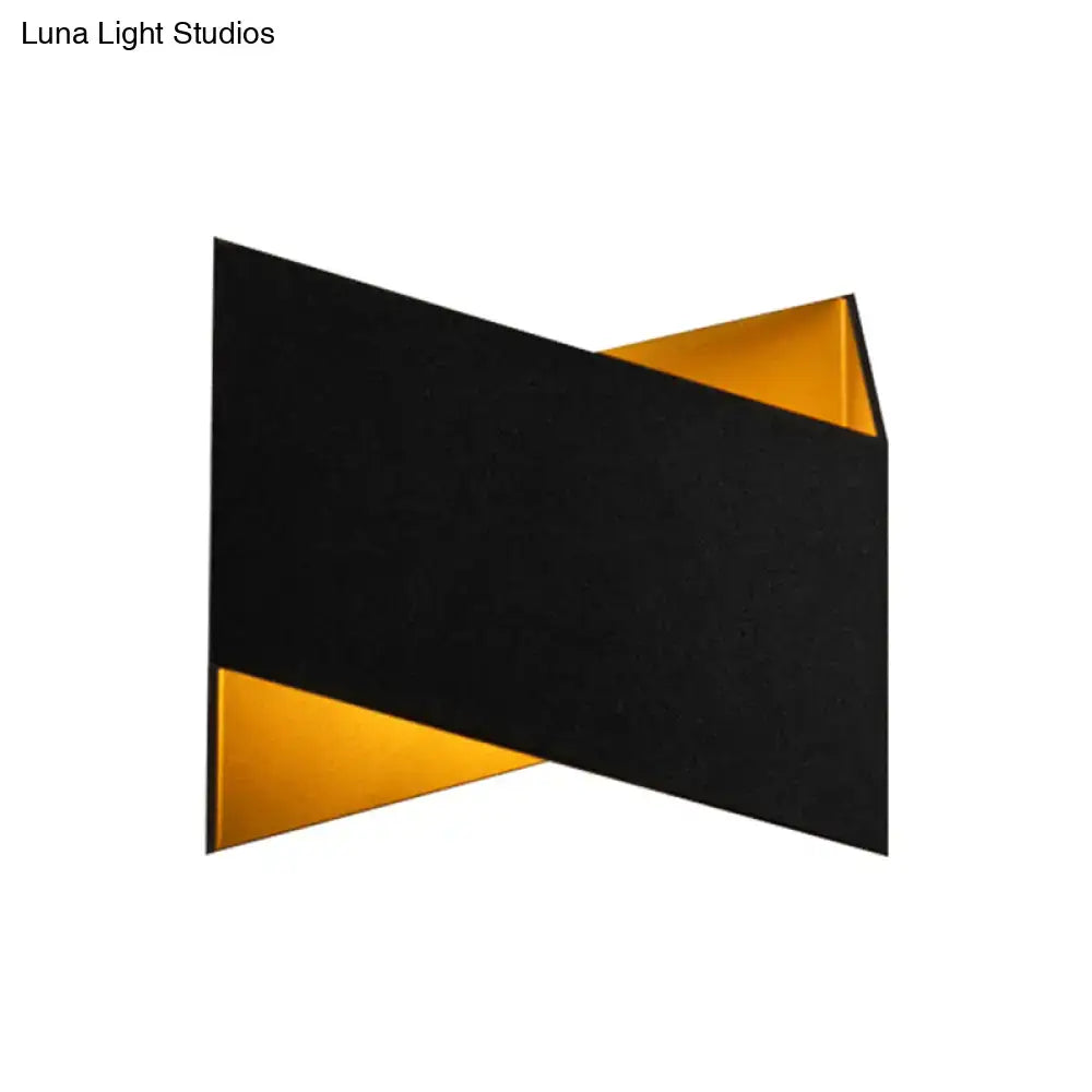 Modern black and gold geometric metal body wall lamp with angular overlapping panels for stairway lighting