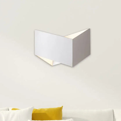 Modern white geometric wall lamp with metal body and clean angular design for contemporary stairway lighting