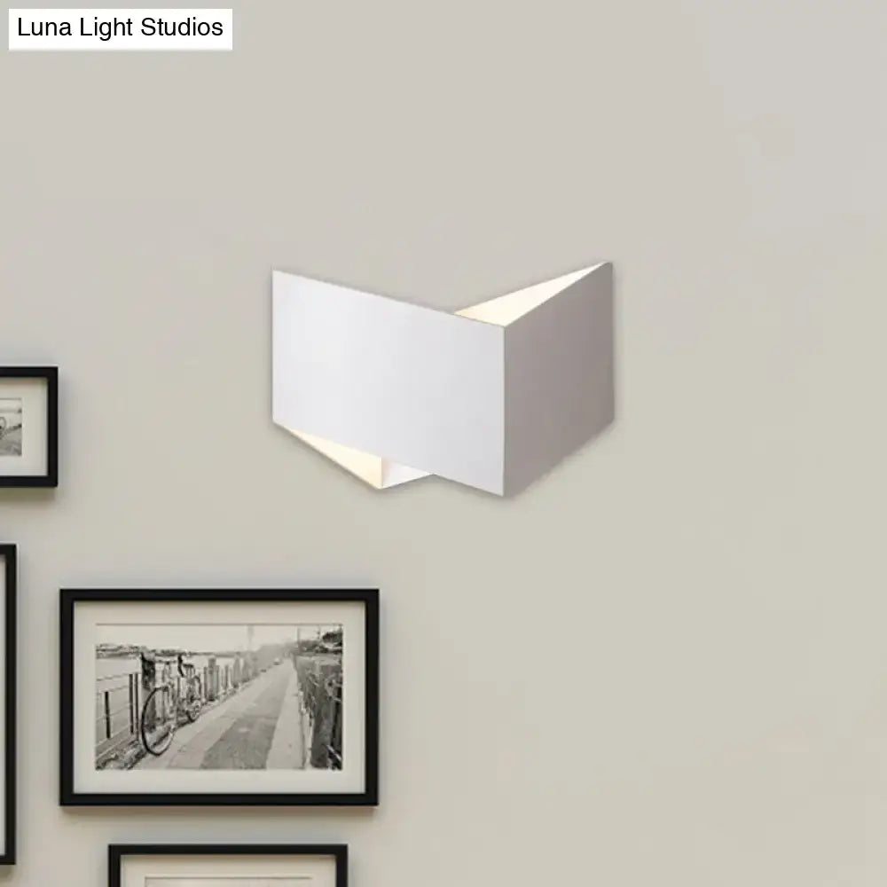 Modern white geometric wall lamp with metal body featuring a clean angular design ideal for stairway lighting