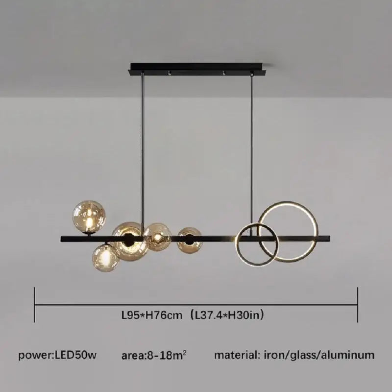 Modern black metal chandelier with amber glass spheres and circular rings for dining room decorbites glass ball gold design