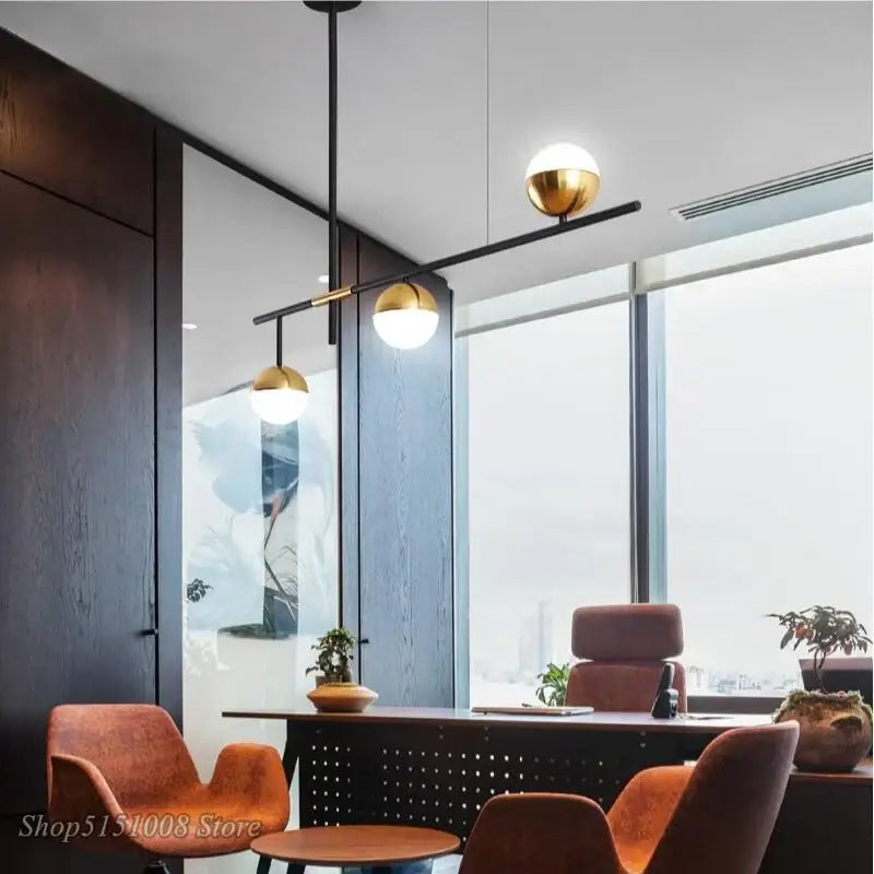 Modern black and gold glass ball pendant lamp with three spherical gold-finished bulbs for dining room decorbites pendant lamp