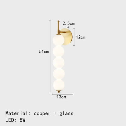 Modern black and gold glass bedside led wall lamp with five frosted glass spheres and brass finished copper arm for decorbites