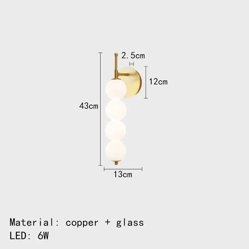Modern black and gold glass bedside led wall lamp with brass-finished copper base and four frosted glass spheres decorbites glass bedside