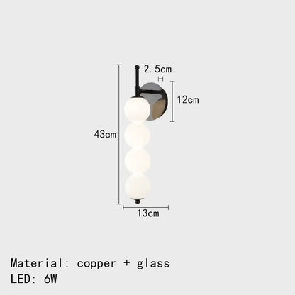 Modern black and gold glass bedside led wall lamp with four frosted glass spheres on copper mounting bracket for bedroom decorbites wall lamp