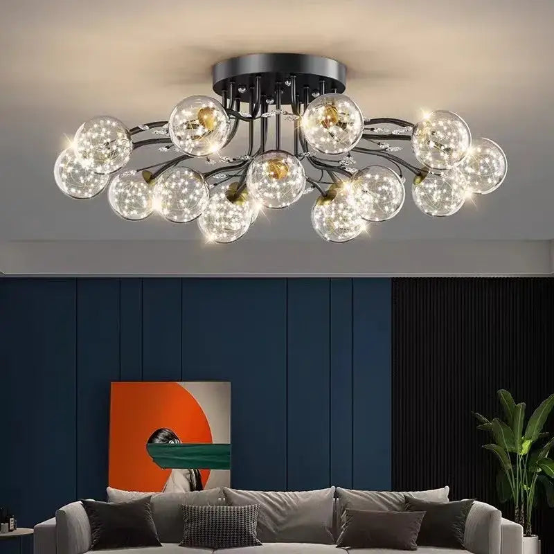 Modern black metal glass bubble ball ceiling light with clear globes emitting warm light for living room decorbites