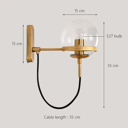 Modern black and gold glass globe wall sconce lamp with clear glass globe and black cable for bedroom lighting