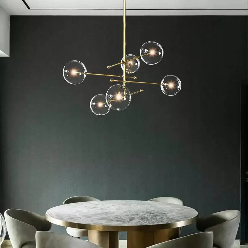 Modern black gold glass led chandelier featuring brass structure with clear glass globe bulbs for living room decorbites black gold
