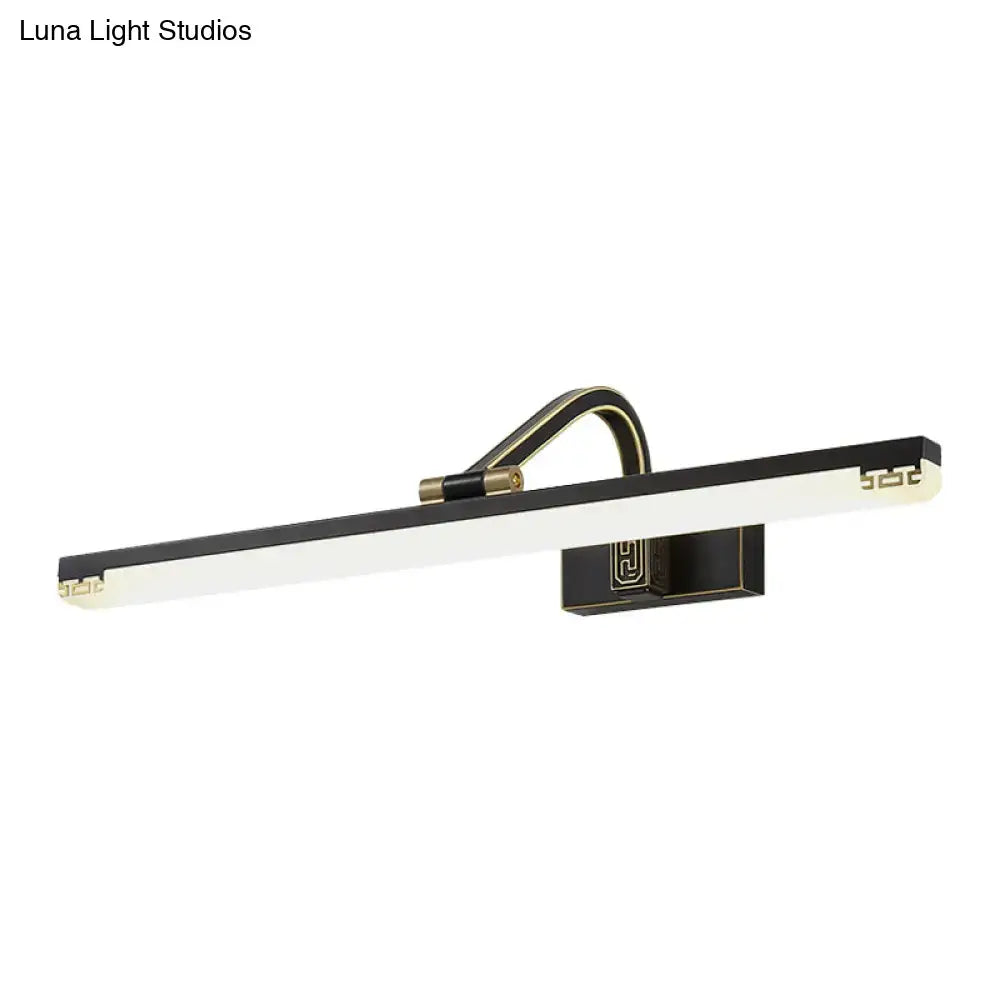 Modern black and gold swing arm wall lamp with rectangular design and ornate geometric mounting bracket detail