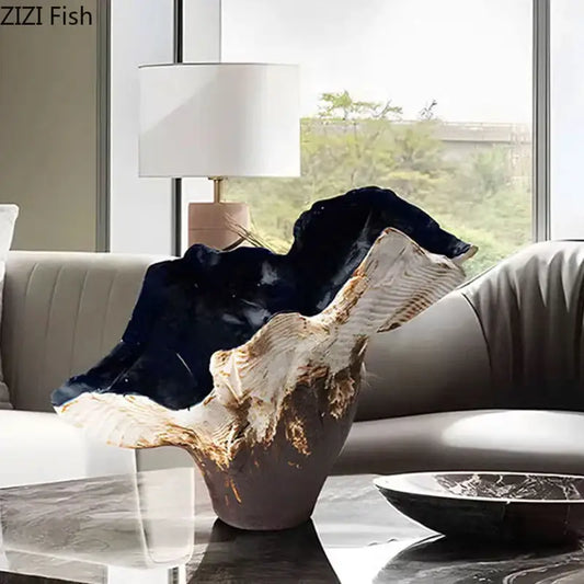 A sleek modern black and gold irregular shape vase with a glossy resin finish for bedroom decorbites decor
