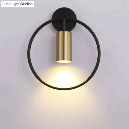 Modern black and gold irwin wall lamp with a sleek minimalist circular design ideal as a bedroom wall lamp