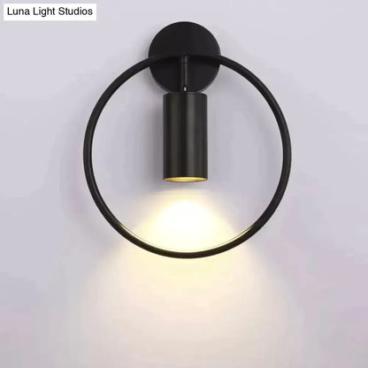 Modern black and gold irwin wall lamp circular wall sconce with sleek minimalist design and warm ambient lighting