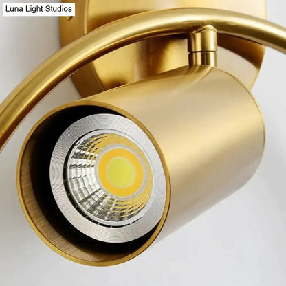Gold-finished irwin wall lamp with cylindrical housing and visible led bulb for modern bedroom sconce lighting