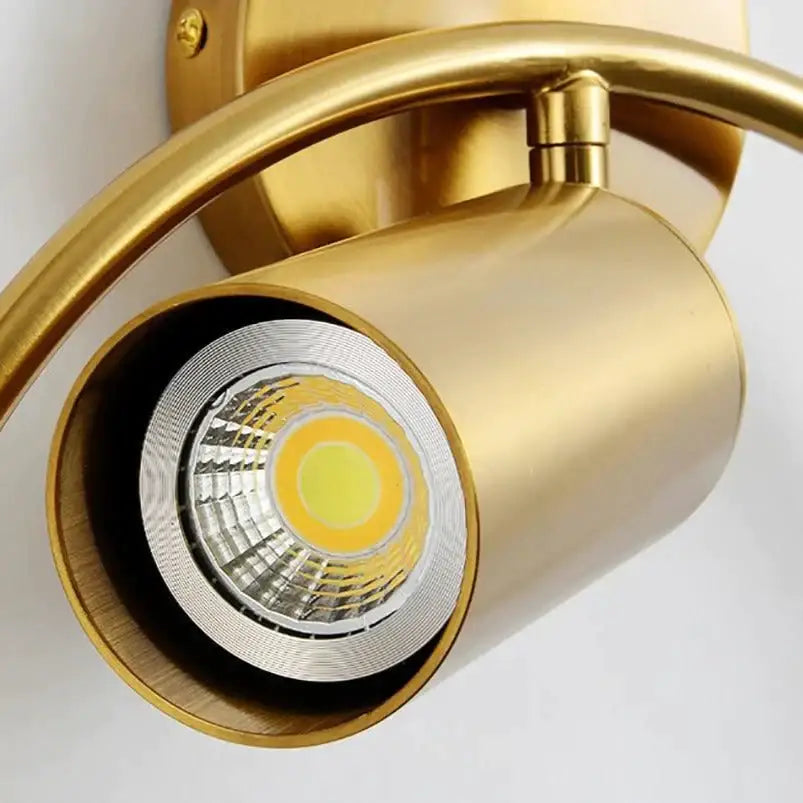 Gold-finished irwin wall lamp with cylindrical housing and visible led bulb for modern bedroom sconce lighting