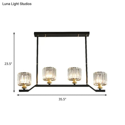 DecorBites modern island pendant light with black metal, gold accents, and clear crystal cylinder barrel shade shape
