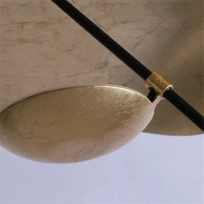Modern black and gold leaf pendant light with matte gold texture and black cable for living room decorbites gold texture