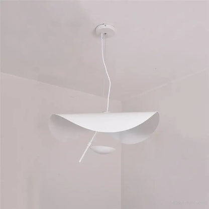 Modern black and gold leaf pendant light with sleek white shell-like shade featuring decorbites gold texture for living room decor