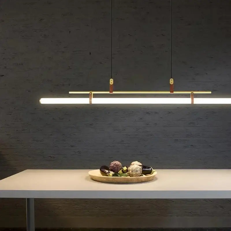 Modern black gold leather tube led pendant light with sleek rectangular design and warm gold leather accents for dining room