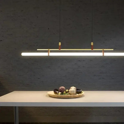 Modern black gold leather tube led pendant light with sleek rectangular design and warm gold leather accents for dining room