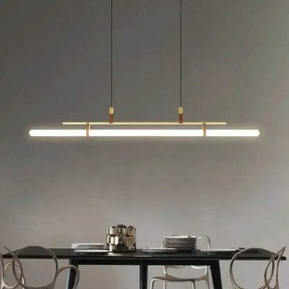 Modern black gold leather tube led pendant light with sleek rectangular design and warm white illumination for dining room