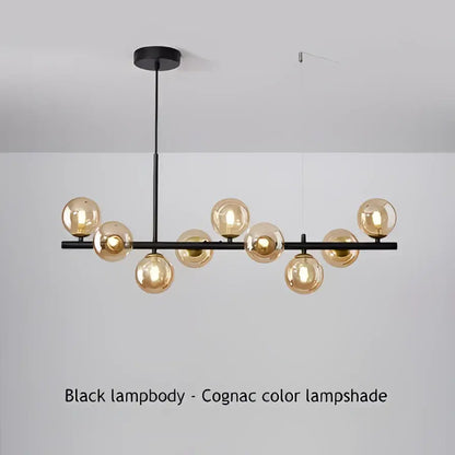 Modern black led pendant chandelier with gold accents and multiple spherical cognac glass lampshades for living room