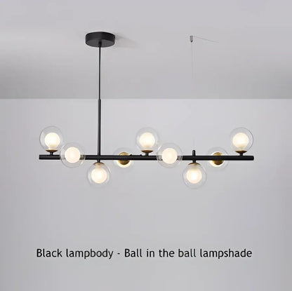 Modern black led pendant chandelier with spherical glass lampshades and gold accents for living room lighting