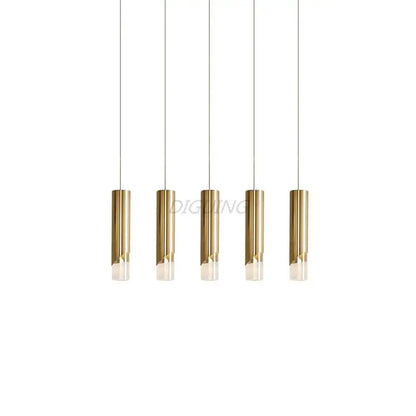 Five sleek gold and black led pendant lights with frosted glass hang from cords made of high-quality die-cast aluminum