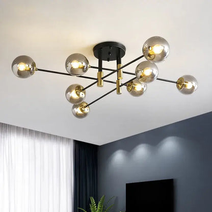 Modern black and gold led round ball chandelier with spherical glass bulbs on metal arms for dining room lighting