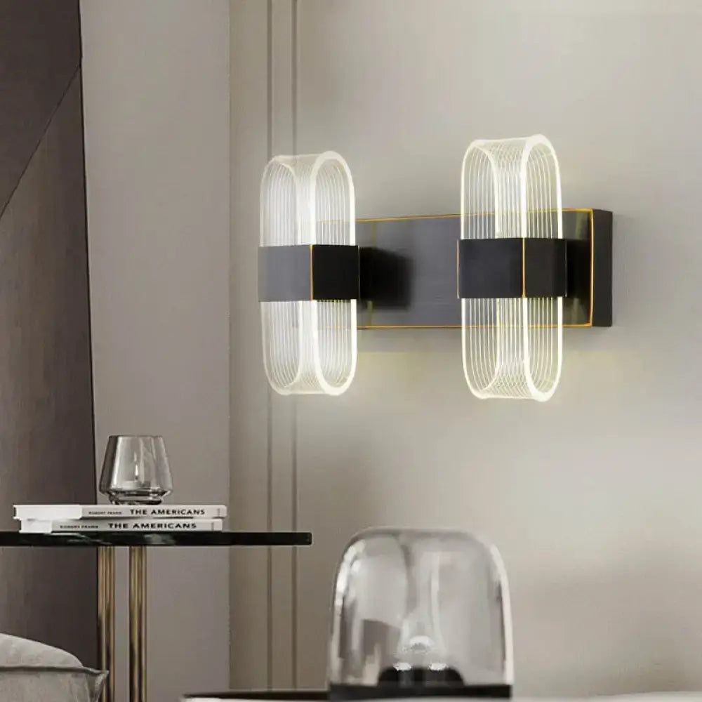 Modern black and gold led sconce light with sleek metal frames and ribbed glass shades for bedroom wall mount