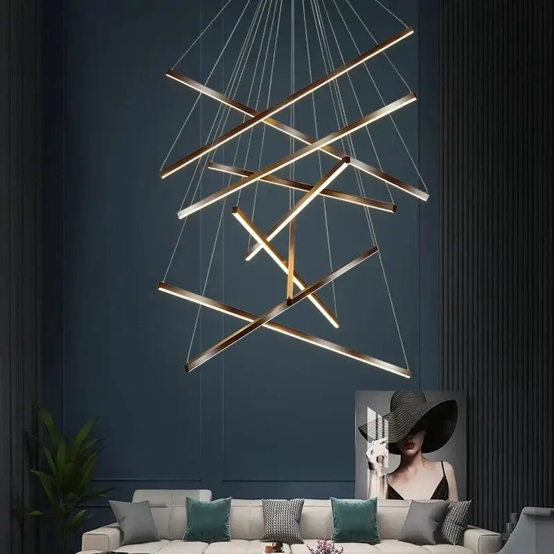 Modern black and gold led stair chandelier with intersecting gold toned metal bars and integrated lighting decorbites black led