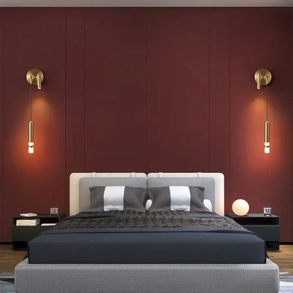 Modern bed with gray and white checkered headboard, dark blue bedding, and decorbites gold led wall lamp reading light